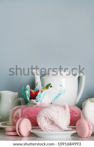 Candy bar with cakes, muffins, meringues, macaroons and biscuits. Pastel shades. Children's holiday