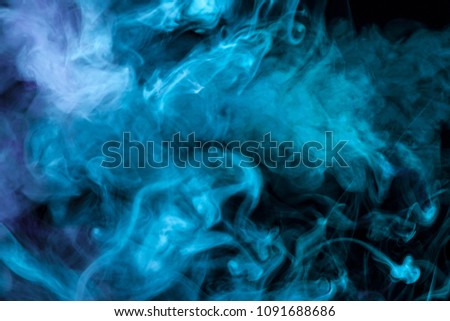  blue smoke  on a black isolated background. Background from the smoke of vape
