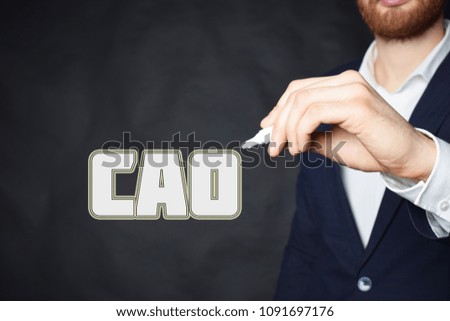 The businessman writes an inscription with a white marker:CAO