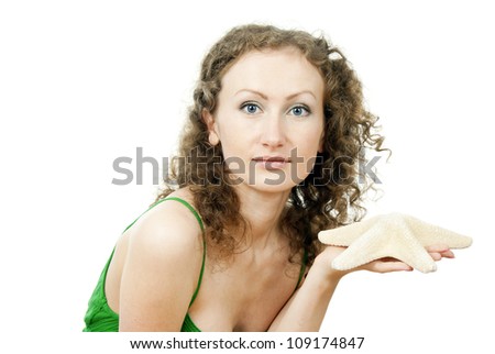happy girl holding a starfish isolated