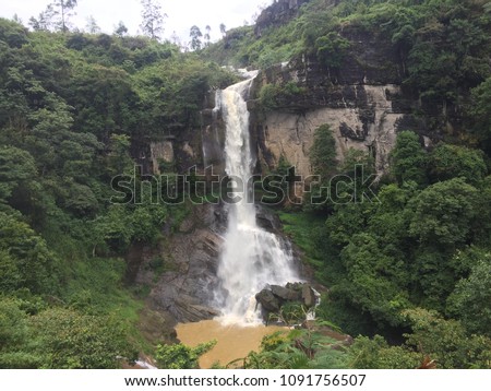 A picture of a waterfall which is called as rambode falls.This picture is taken from the viewpoint of it.
