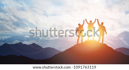 Silhouette of the team on the mountain. Leadership Concept Royalty-Free Stock Photo #1091763119