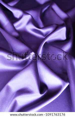 Beautiful smooth elegant wavy violet purple satin silk luxury cloth fabric texture, abstract background design. Card or banner.