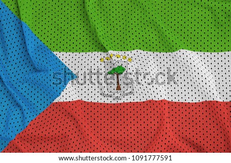 Equatorial Guinea flag printed on a polyester nylon sportswear mesh fabric with some folds