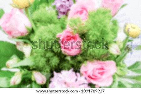 Defocused background of a colorful mix of flowers. Intentionally blurred post production for bokeh effect