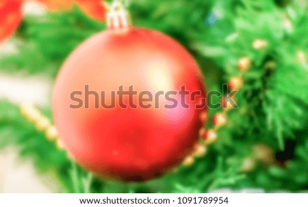 Defocused background of a Christmas Tree with red decorations. Intentionally blurred post production for bokeh effect