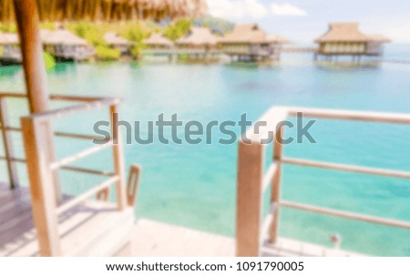 Defocused background with Overwater Bungalows in French Polynesia. Intentionally blurred post production for bokeh effect