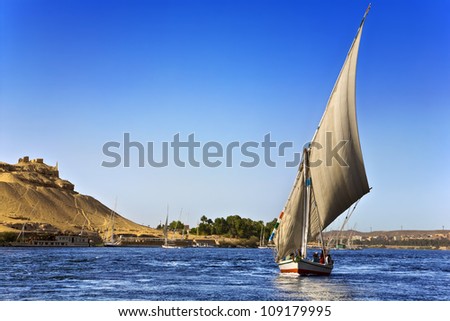 Egypt. The Nile at Aswan. There is the West Bank with Tombs of the Nobles on left side