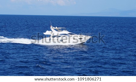 Photo of cruising yacht in deep blue Aegean sea                