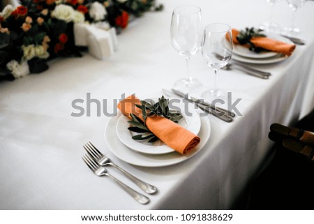 Wedding table setting with flowers and candles 
