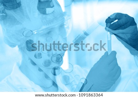 Double exposure female scientists examine the culture of vitro, research, experiment and laboratory tests. Royalty-Free Stock Photo #1091863364