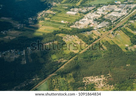Bird eye view of land farmland and nature landscape. Aerial photography of agriculture fields in countryside.