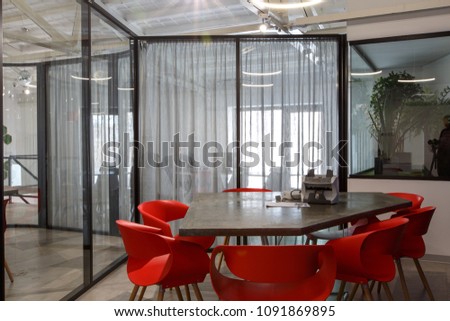 Brand new designed office interior in hi tech stile. Many steel, glass and natural wood elements, white walls and ceilings.  Royalty-Free Stock Photo #1091869895