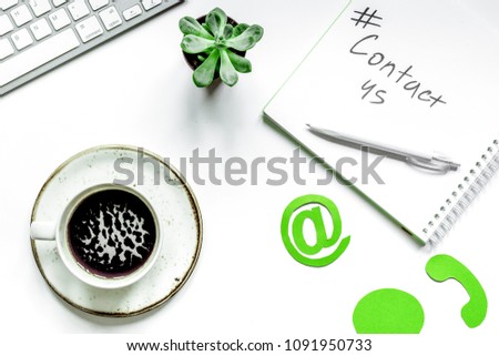 e-mail contact us concept with internet icons and coffee work de