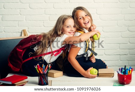 Back to school and home schooling. little girls back to school at knowledge day Royalty-Free Stock Photo #1091976026