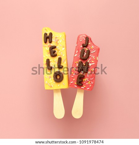 Hello June chocolate text and two ice creams with sprinkles on pink pastel background. Royalty-Free Stock Photo #1091978474