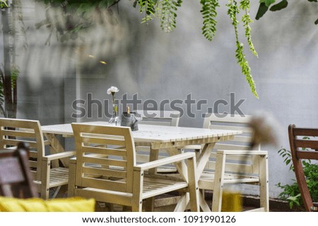 Table and chairs in the garden Surrounded by nature and selective focus