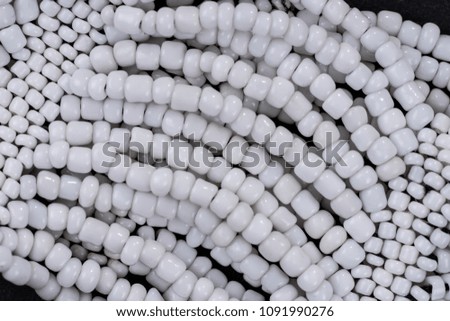 Closeup of white pearls necklaces. Fashion background texture