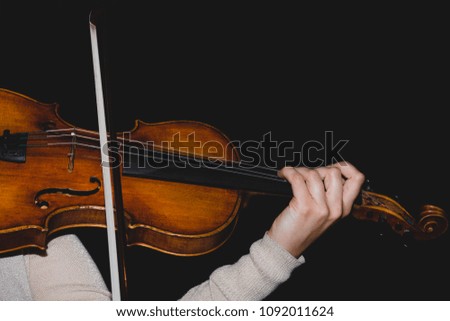 Woman playing violin.