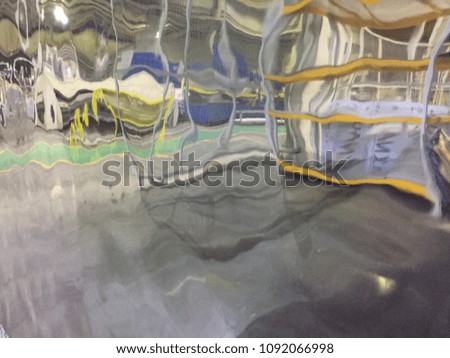 Reflective surface watermarked stainless steel
