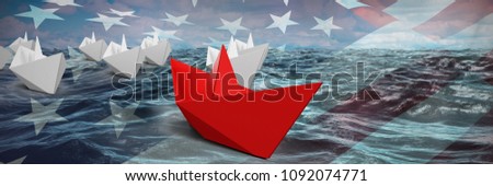 Composite image of red and white paper boats made of origami
