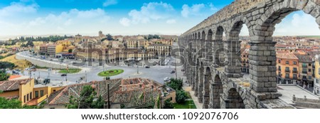 Panoramic view at Plaza del Azoguejo and the historic Roman aqueduct. Royalty-Free Stock Photo #1092076706