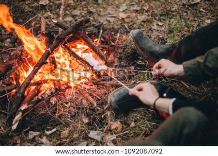 sit by the fire and fry marshmallows