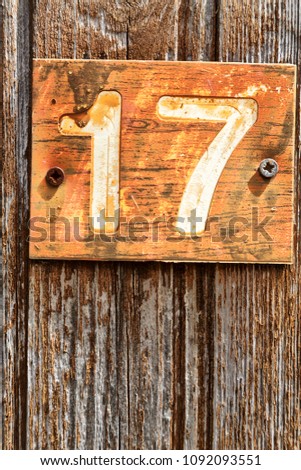 in cyprus in the old door the number seventeen in a rusty and dirty plate concept of 