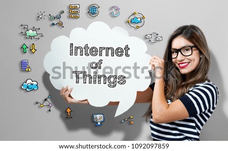 Internet of Things text with young woman holding a speech bubble