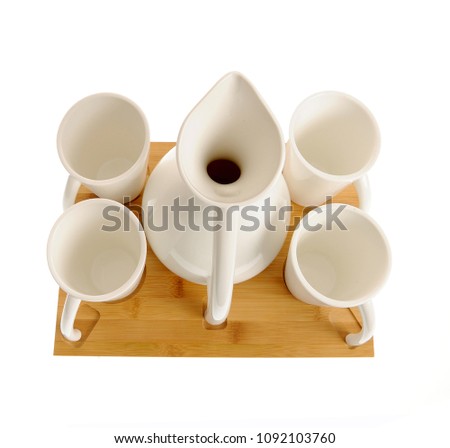 Elegant ceramic tea set with bamboo elements isolated on white background