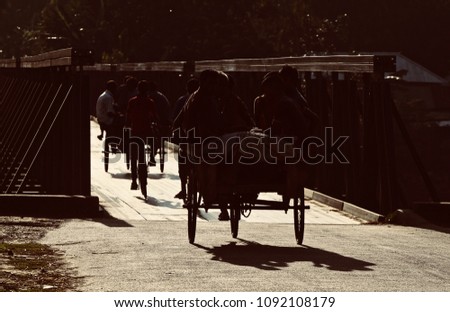 People are travelling in the traditional three wheelers on the streets isolated unique photograph