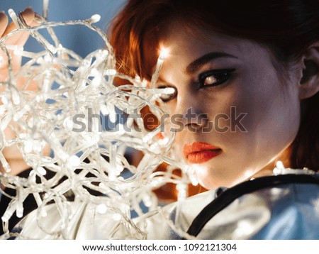 woman with luminous garlands