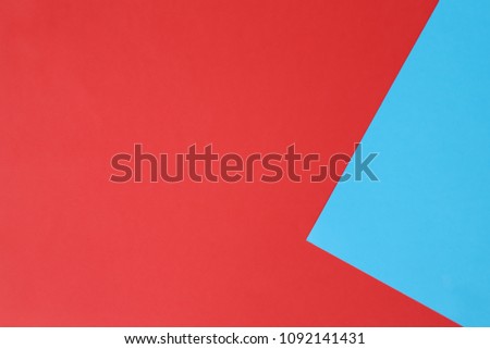 Red and blue pastel color papers geometric flat laying as background  and template.
