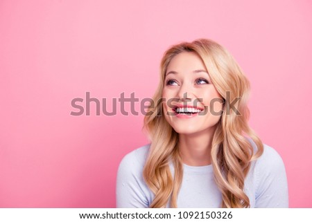 Portrait with empty place of foolish childish funny girl with modern hairdo beaming smile looking at copy space laughing isolated on pink background Royalty-Free Stock Photo #1092150326
