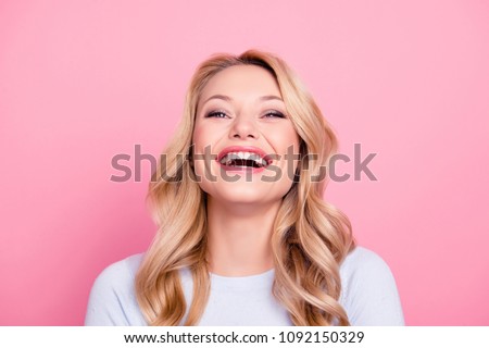 Portrait of foolish positive girl with modern hairstyle laughing sincerely with beaming smile isolated on pink background. Mood inspiration enjoyment pleasure concept Royalty-Free Stock Photo #1092150329