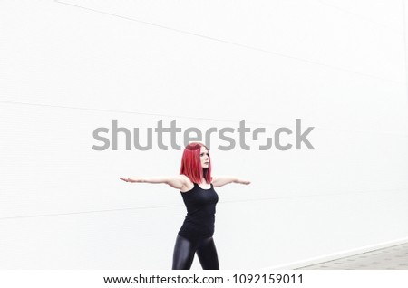 Beautiful yoga girl with yoga mat isolated over white wall background