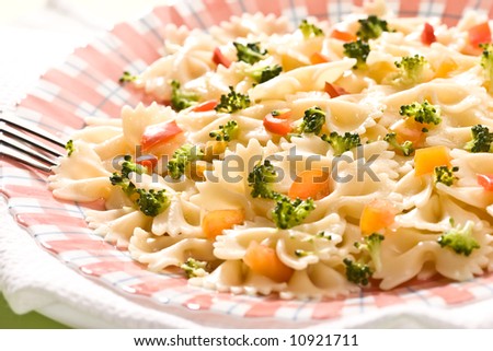 Macro picture of appetizing cooked pasta with vegetables
