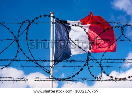 French Border with Flag of France and barbed Wire