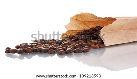 Coffee beans is poured from a paper bag isolated on white