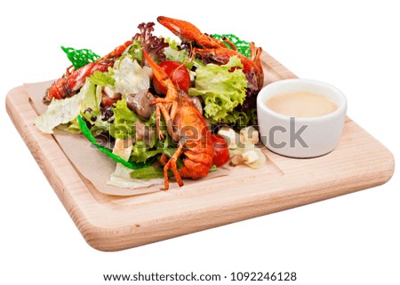 Boiled crayfish with salad and sauce on wooden board.  Snack for beer party. Food photography for restaurant menu. Isolated on white background. Tif