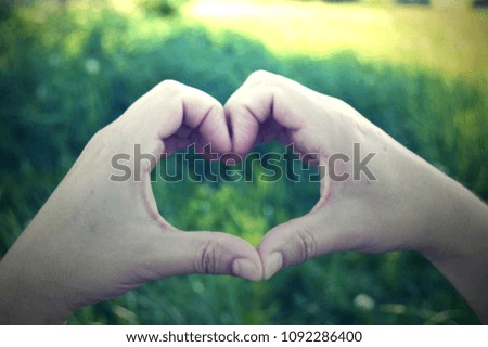 Heart symbol of love and harmony. Older hands. Together forever.