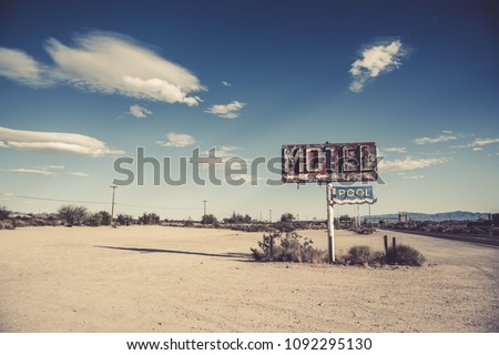 A dilapidated, classic, vintage motel sign in the desert of Arizona Royalty-Free Stock Photo #1092295130