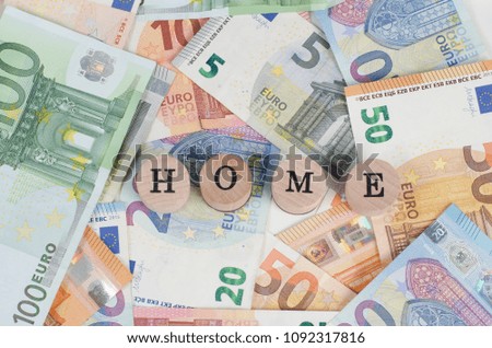 Euro banknotes with the address Home in foreground

