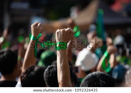 People raised hand air fighting for protest