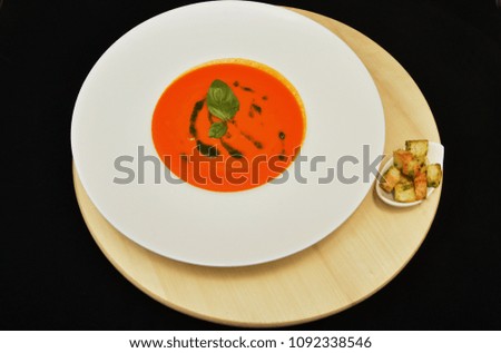  plate with red -orange sauce, salsa sauce,Taco sauce with basil