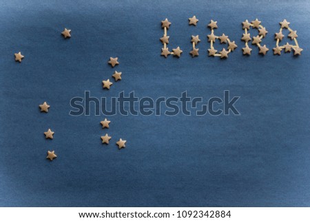 Sign Libra on a blue background, personal horoscope. The scheme is laid out with small stars. Copy space, vignetting. The picture is made by the author.