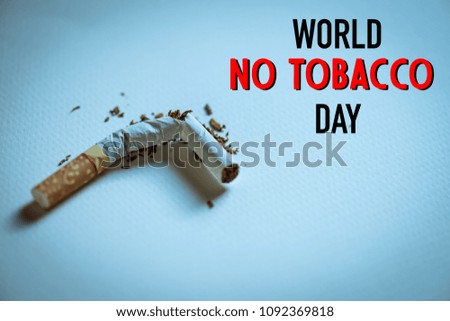 World No Tobacco Day, May 31. Close up Broken cigarette on white paper blackground in dark condition.