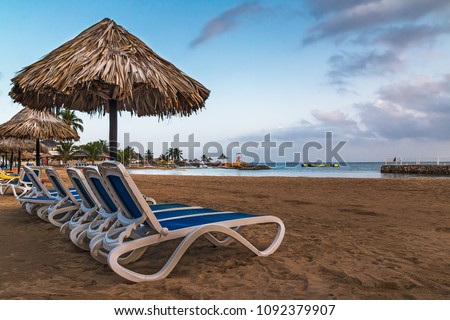 Relaxing on the Beach in Runaway Bay, St Ann, Jamaica. Royalty-Free Stock Photo #1092379907