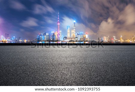 clean asphalt road with modern city skyline background,shanghai,china