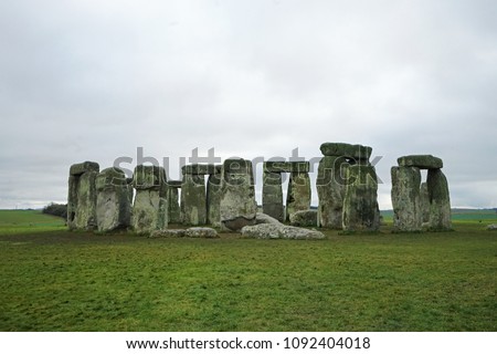 Natural landscape of Stonehenge, the unique stone circle and world’s most famous prehistoric monument with cloudy sky